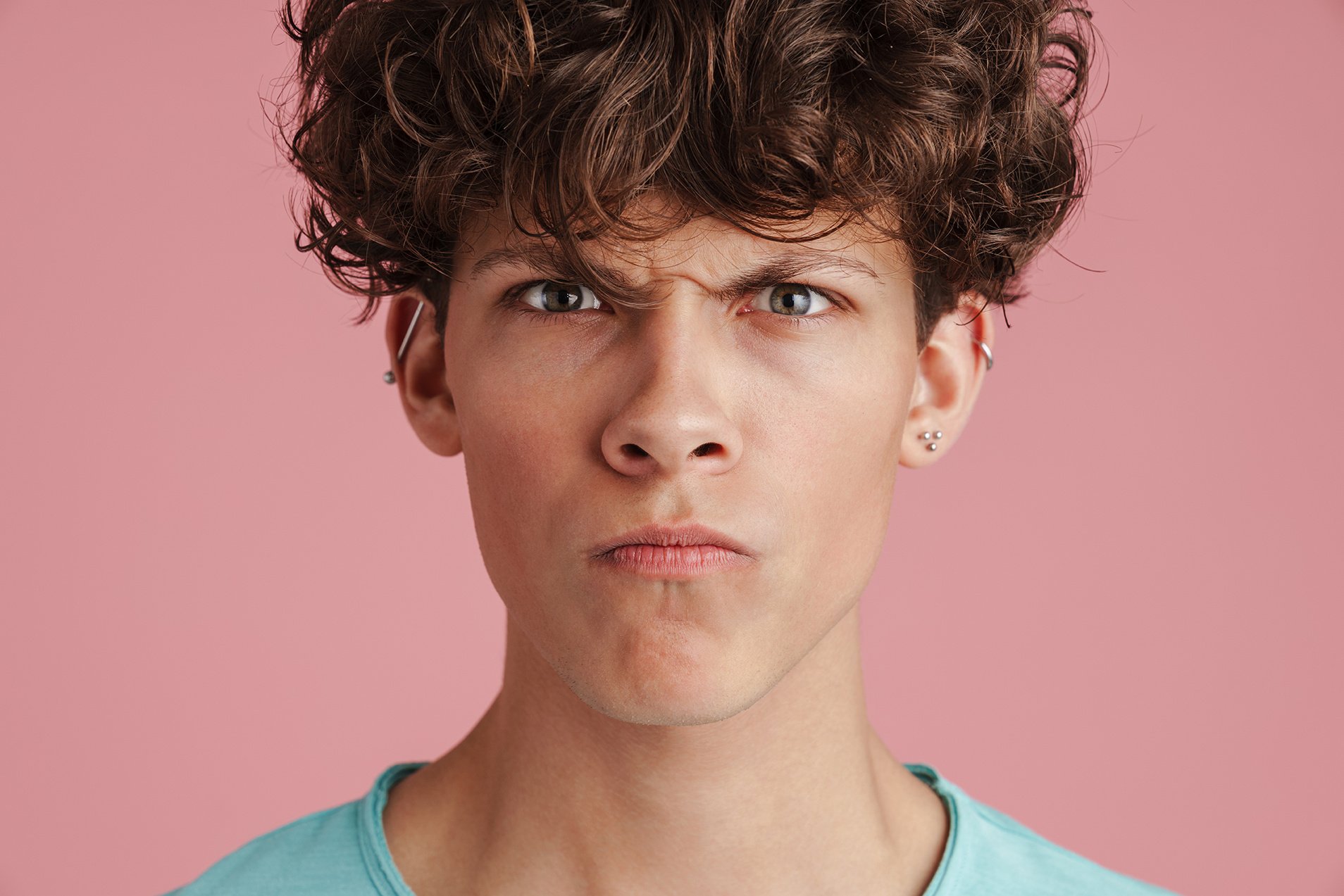 angry-young-teenager-looking-at-camera-isolated-2023-11-27-04-54-02-utc