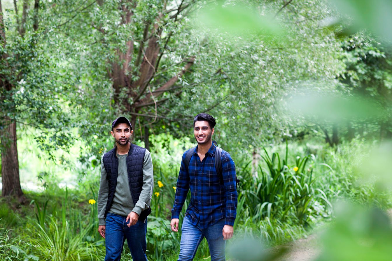friends-walking-in-park-together-2024-06-25-18-03-39-utc