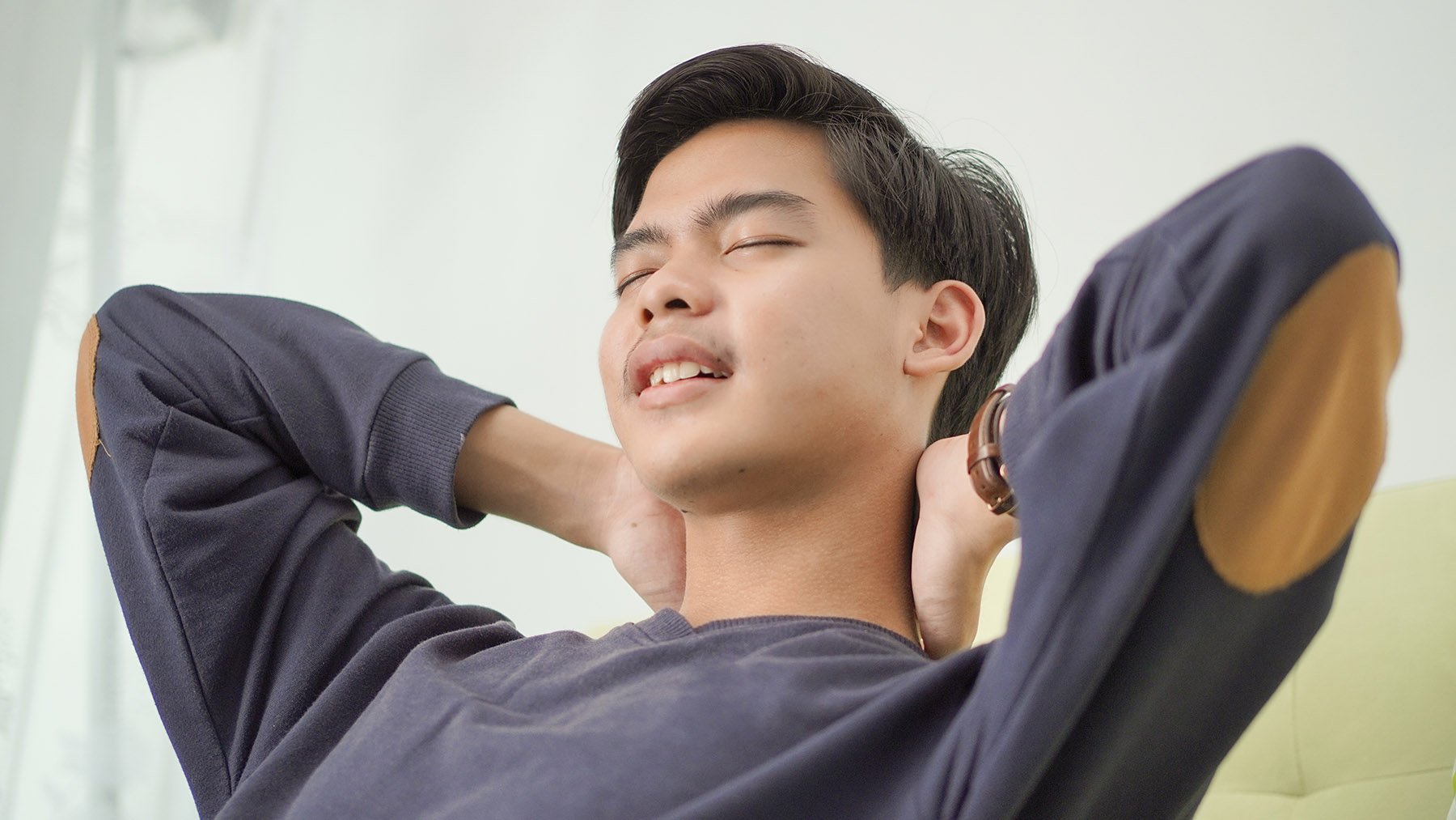 tired-asian-young-man-closing-his-eyes-looking-for-2023-11-27-05-15-06-utc